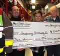 Hap and Barb Daus with donation check