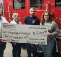 From left, Paul Budden, Chris Budden, and volunteer firefighters John Fick and Melissa Lovell