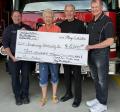 Pictured from left, Fire Chief Ryan Simmons, Carol Sue Butts, Ray Meiklejohn, Gene Weber