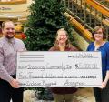 Anonymous Donor Check Being Accepted by Platteville Inclusive Playground Committee Members