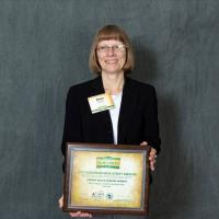 Photo of City of Platteville Common Council President Eileen Nickels accepting the award