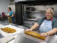 Melissa Kilian (left) and Joann Baraldi of Family Promise of Grant County making Pumpkin Rolls for their fundraiser.