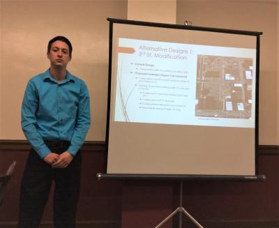 : A UW-Platteville engineering student listens to taskforce feedback during his portion of the downtown parking study presentati