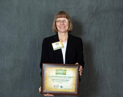 Photo of City of Platteville Common Council President Eileen Nickels accepting the award