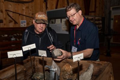Museum Director Erik Flesch explaining minerals to Museum Patron