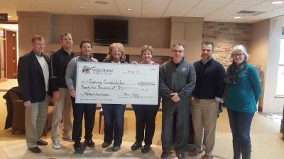 Photo of $25,000 commitment by Wisconsin Bank & Trust