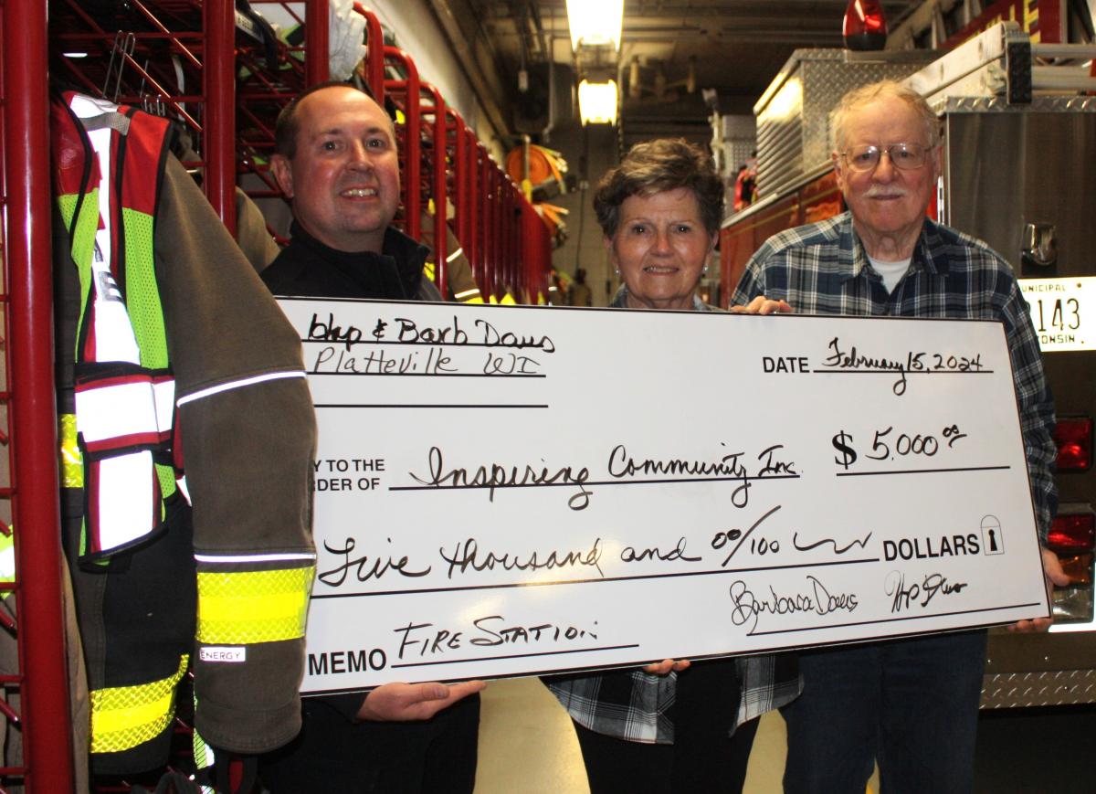 Hap and Barb Daus with donation check