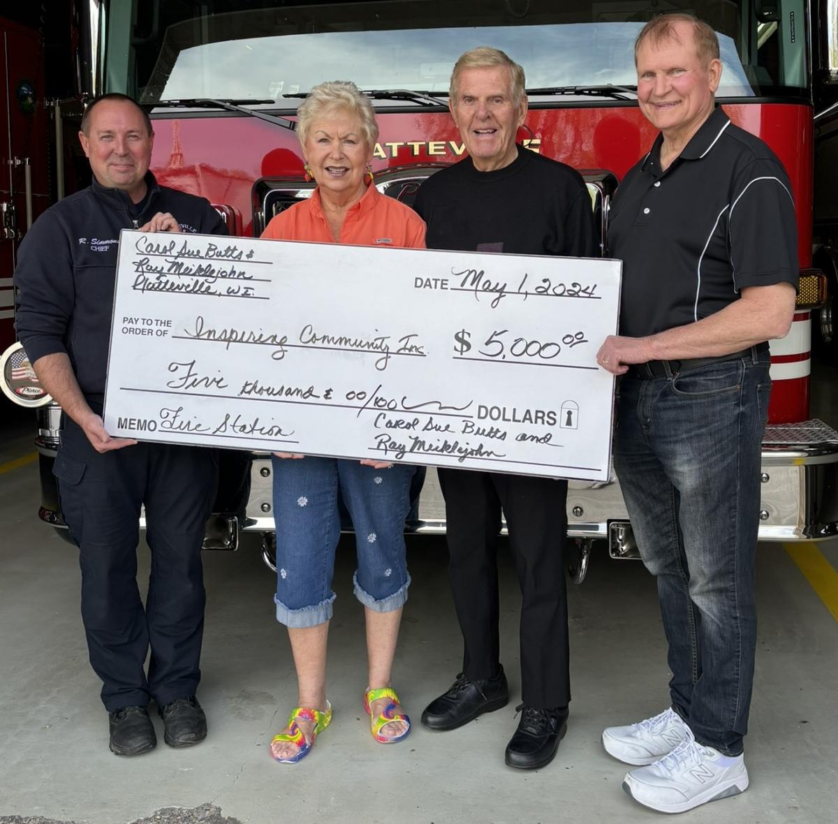Pictured from left, Fire Chief Ryan Simmons, Carol Sue Butts, Ray Meiklejohn, Gene Weber
