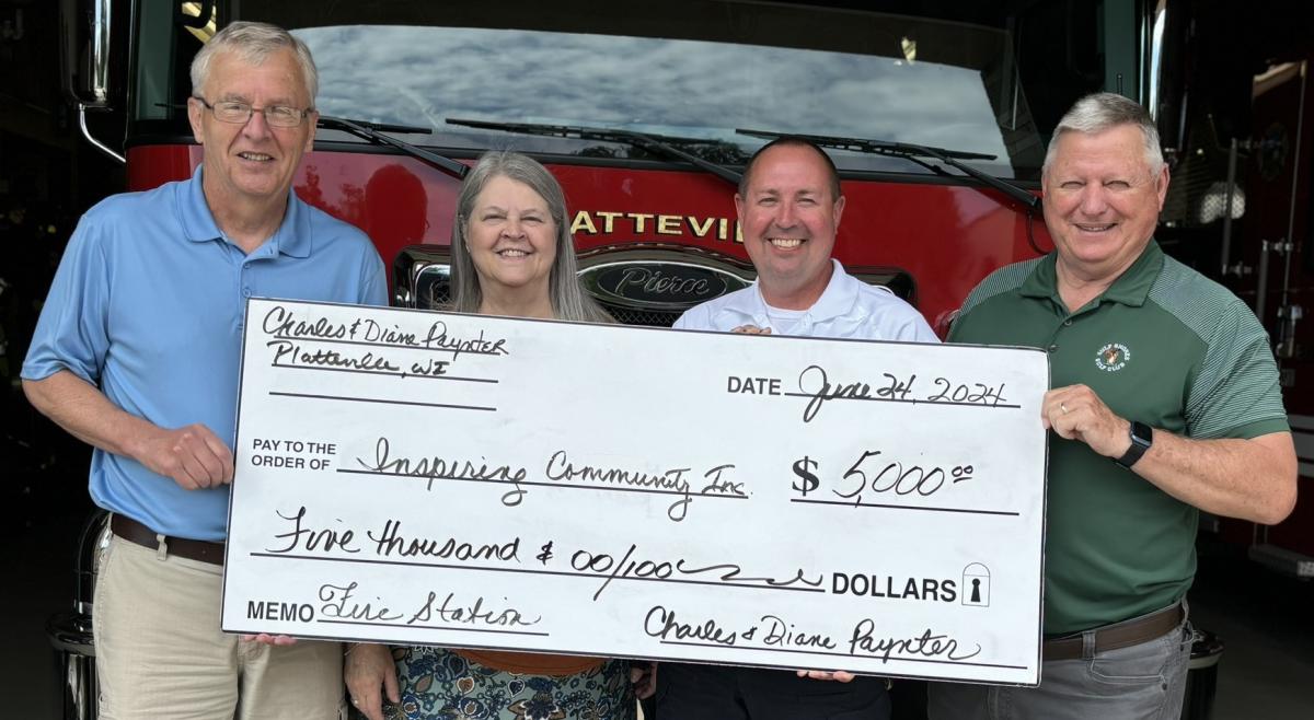 Pictured from left: Charles Paynter, Diane Paynter, Fire Chief Simmons, Paul Budden