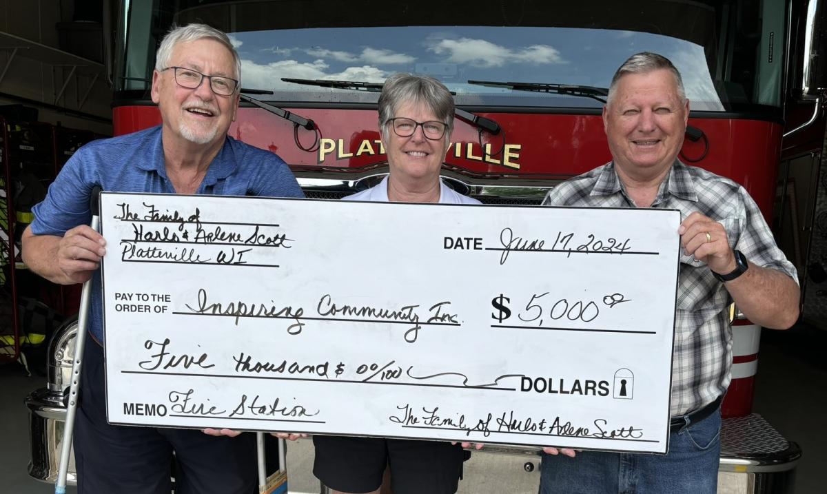  Pictured: Jeff Scott and Deb Bradley-Scott with Paul Budden