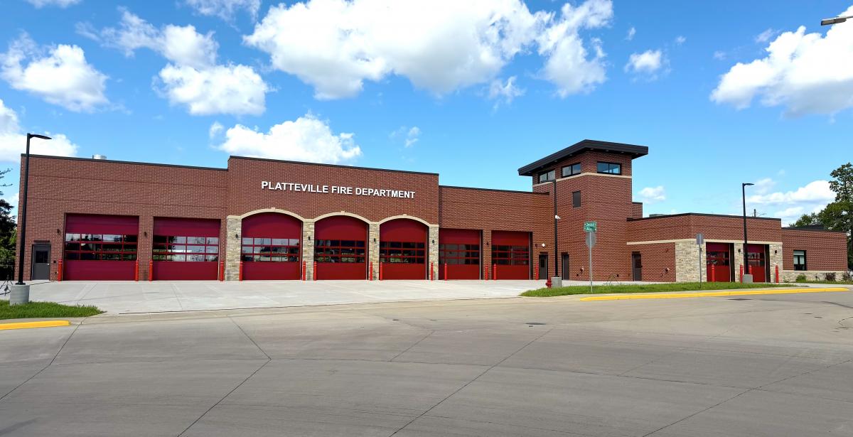Exterior image of new Platteville Fire Facility. Includes visible garage bay doors and training tower