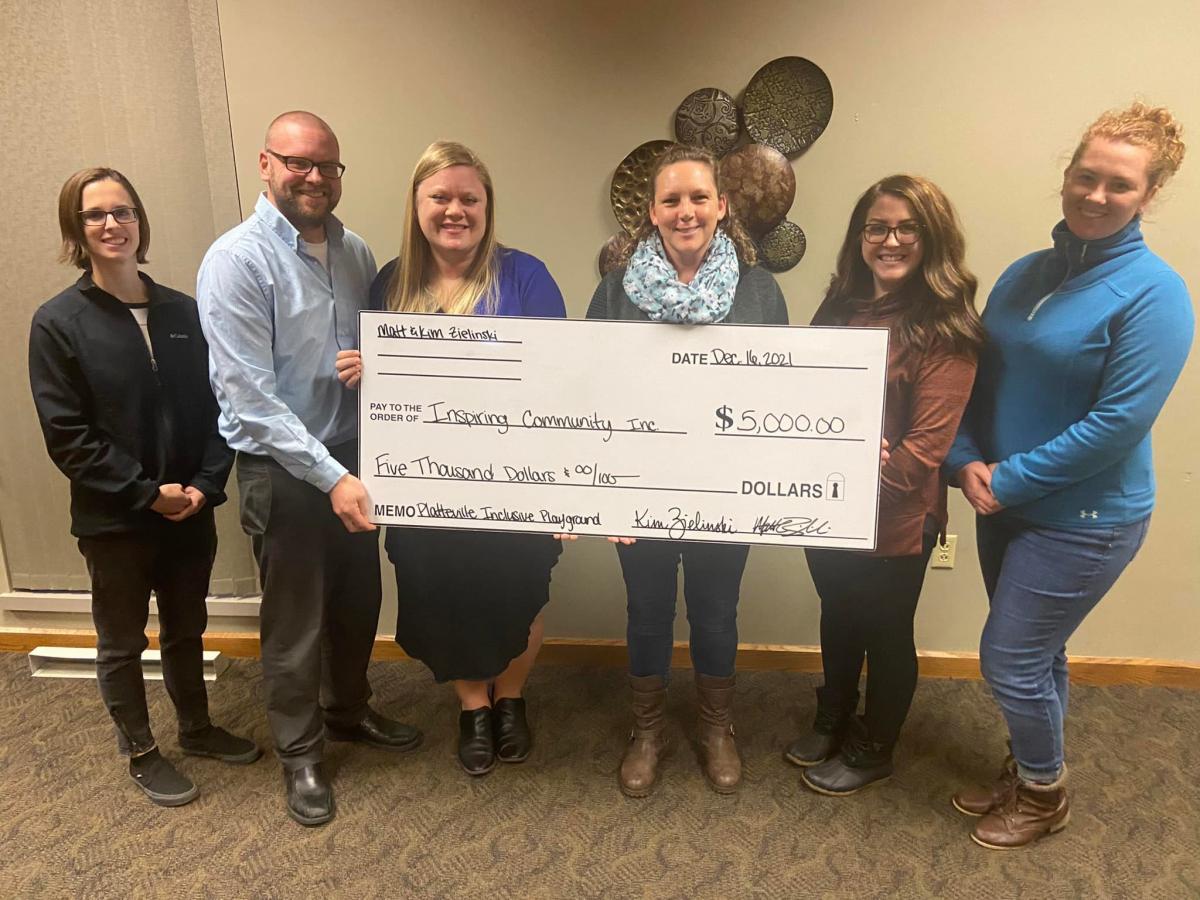 Pictured: Erin Ihm (Fundraising Committee Member), Matt Zielinski, Kim Zielinski, Christina Burr (Steering Committee Co-Chair)